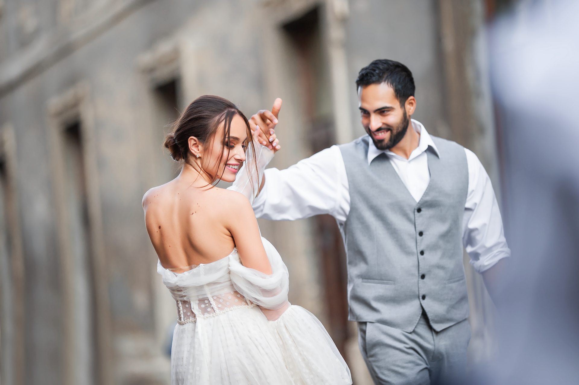 A bride and groom dancing after their wedding for the bella mansions blog 2023 wedding trends