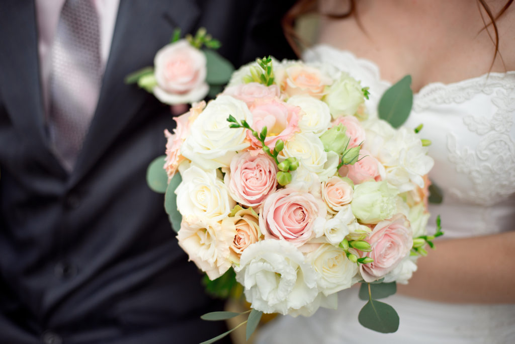 wedding bouquet of pink, white, and creamy roses for Bella Mansions blog on 5 spring wedding bouquet ideas