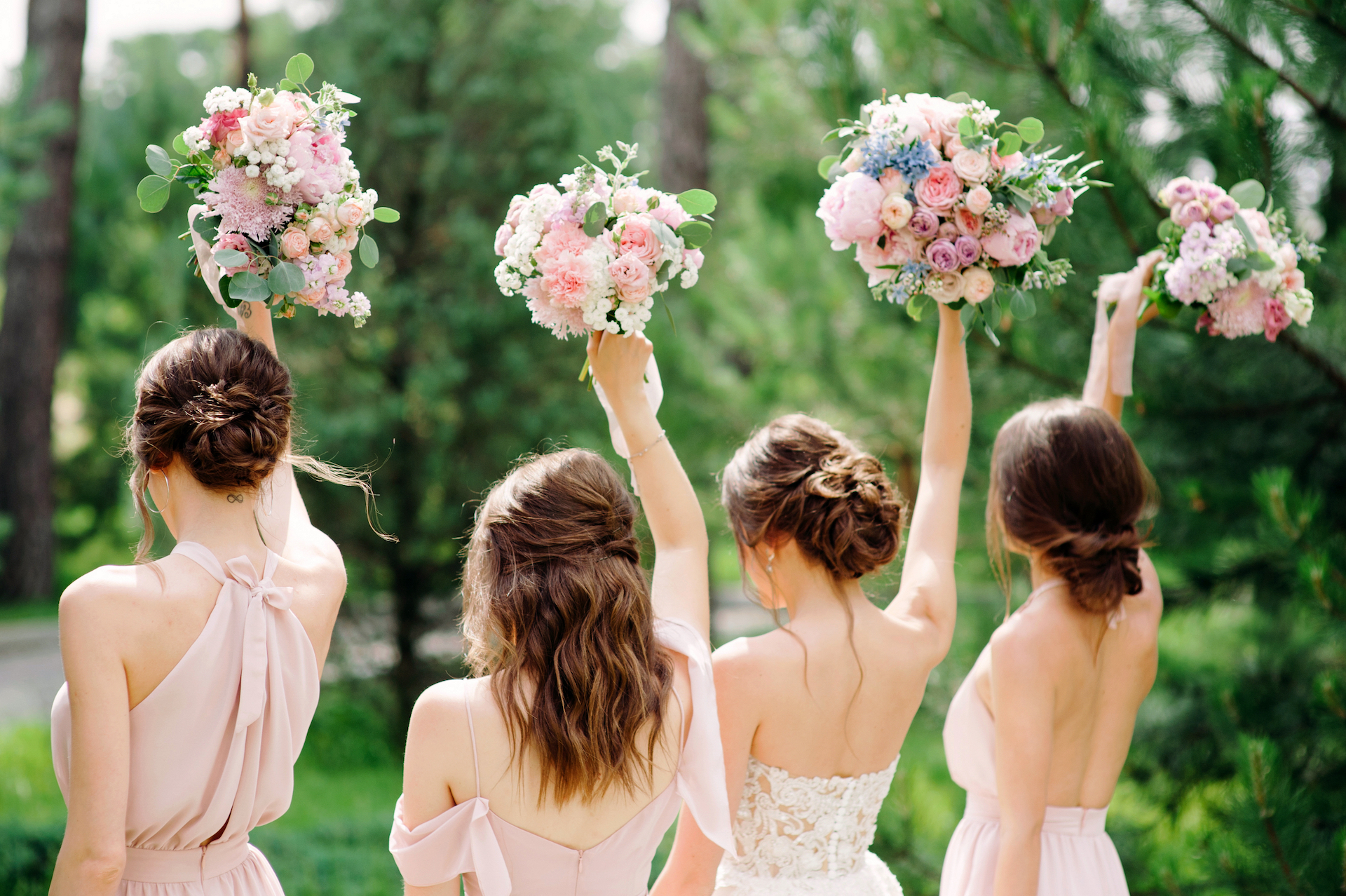 image of bride and bridesmaids holding wedding bouquets